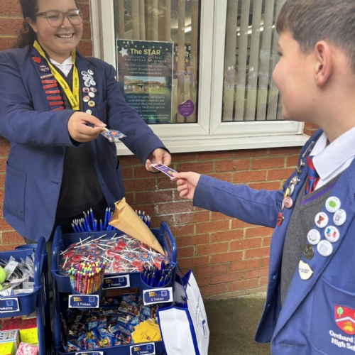 Student at a stall handing out the rewards
